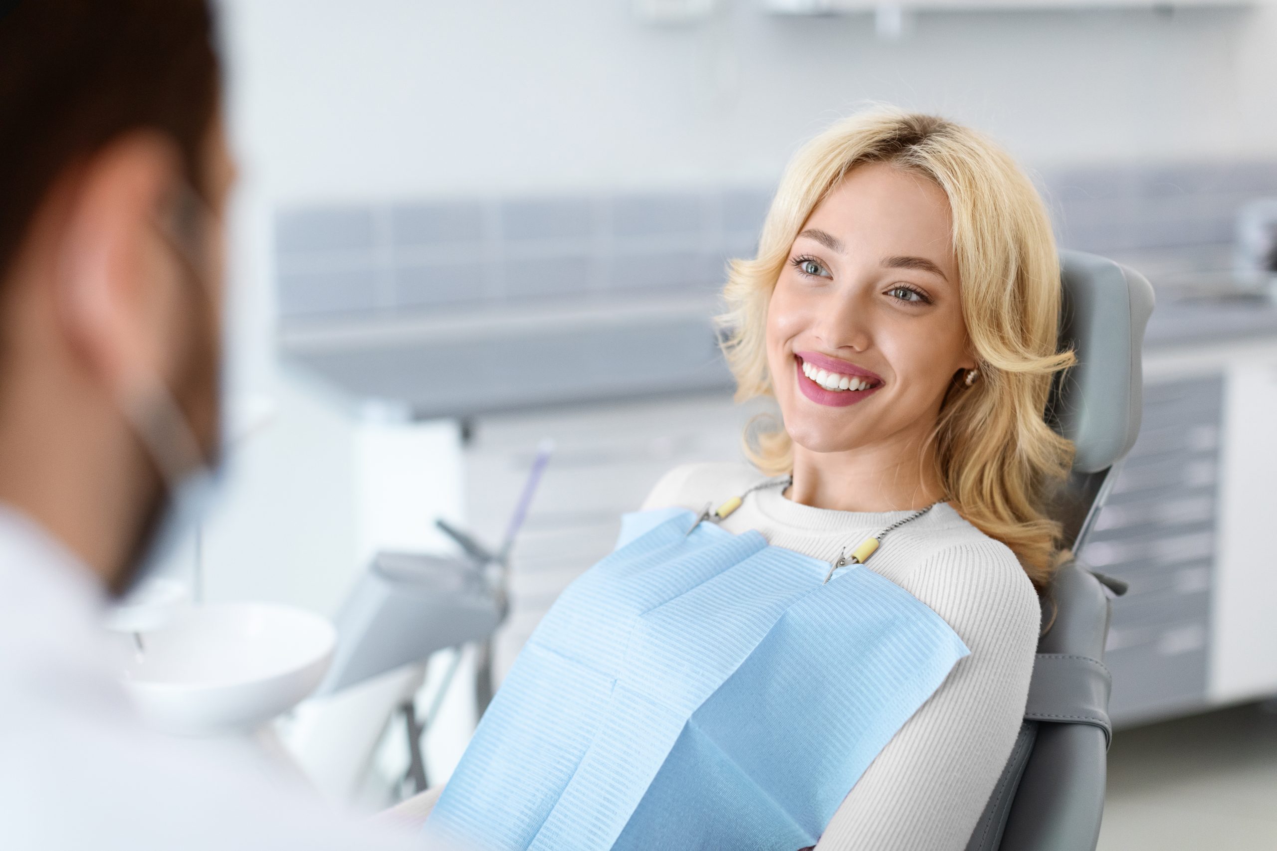 Emergency dentist in Preston treating a patient with tooth pain and swelling in a modern dental clinic